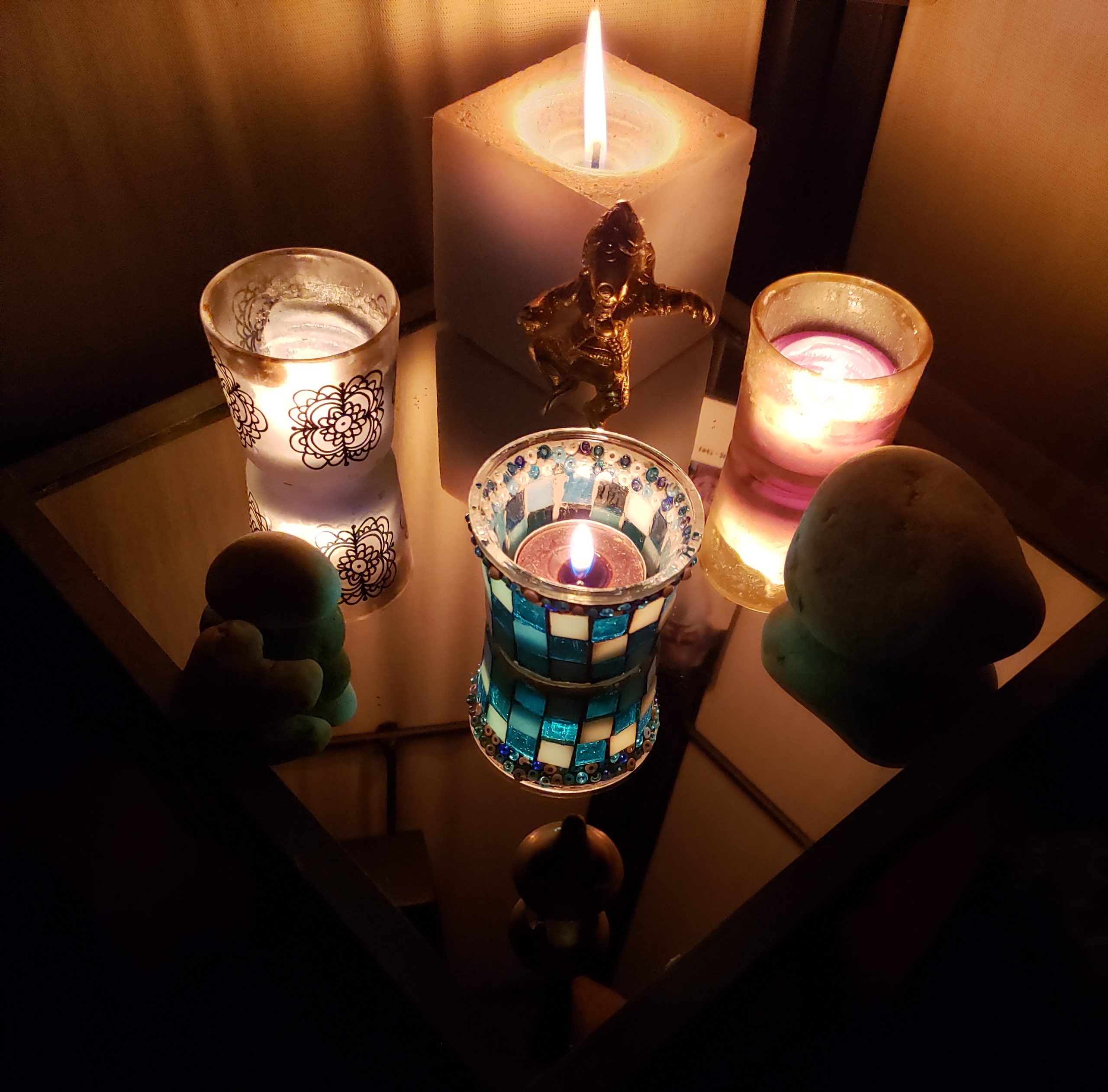 Lit candles on a Meditation Altar